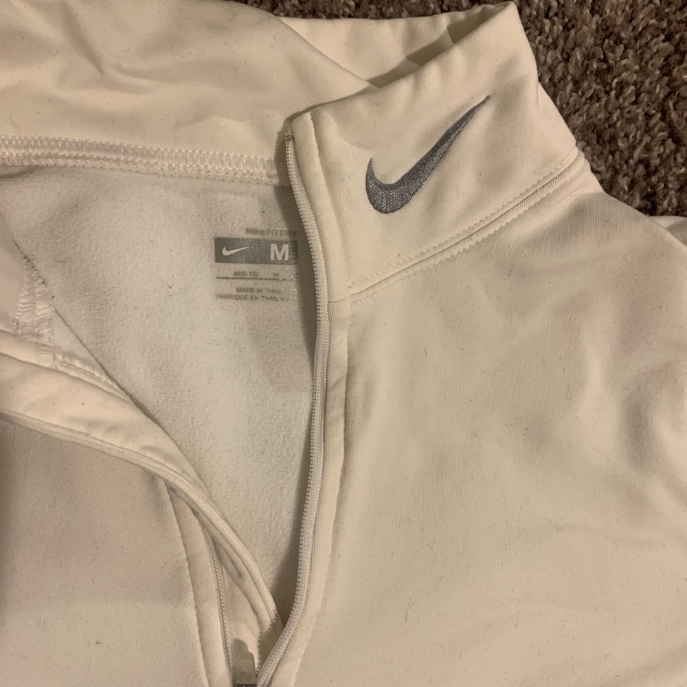 White Nike half zip.